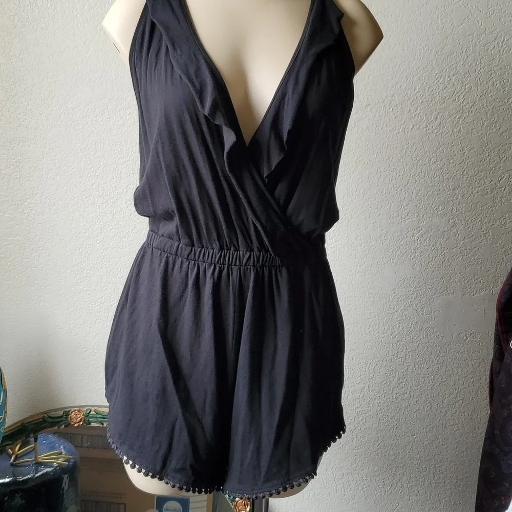 Like new, Romper black with ruffle and trim so cute split up the sides of short - Picture 2 of 7